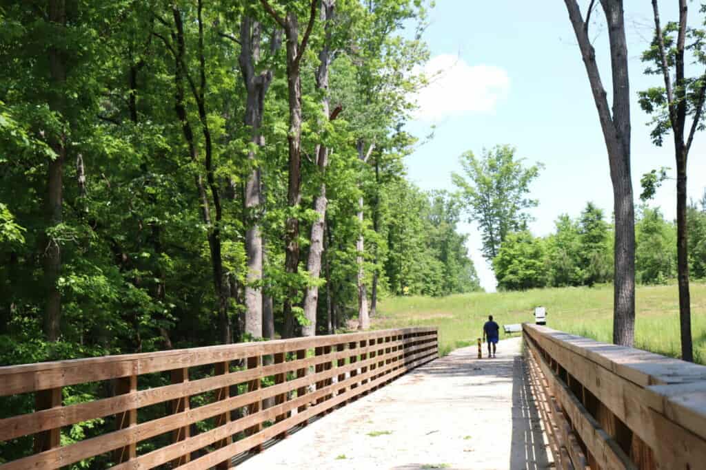 Man hiking on the PATH trail in Henry County in summer.